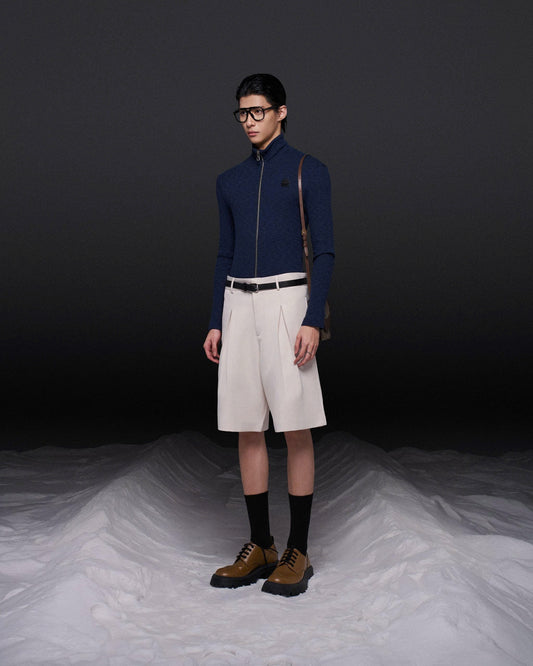 Quần short dáng lửng xếp ly kem